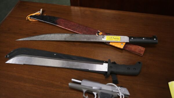 Weapons on display at the U.S. Attorney's office following the arrests of gang members in Boston, Friday, Jan. 29, 2016. Authorities say they have charged 56 members of the MS-13 gang in and around Boston. The gang is notoriously violent and known for using machetes to kill victims. According to court documents, in 2012, MS-13 became the first and remains the only street gang to be designated by the U.S. government as a transnational criminal organization. - Sputnik International