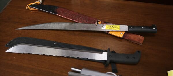 Weapons on display at the U.S. Attorney's office following the arrests of gang members in Boston, Friday, Jan. 29, 2016. Authorities say they have charged 56 members of the MS-13 gang in and around Boston. The gang is notoriously violent and known for using machetes to kill victims. According to court documents, in 2012, MS-13 became the first and remains the only street gang to be designated by the U.S. government as a transnational criminal organization. - Sputnik International