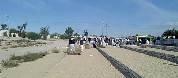 Egyptians gather outside the Rawda mosque, roughly 40 kilometres west of the North Sinai capital of El-Arish, following a gun and bombing attac - Sputnik International