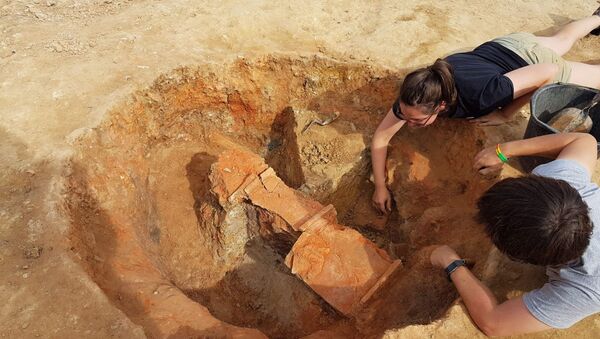 Nero tiles being unearthed at the kiln site. - Sputnik International
