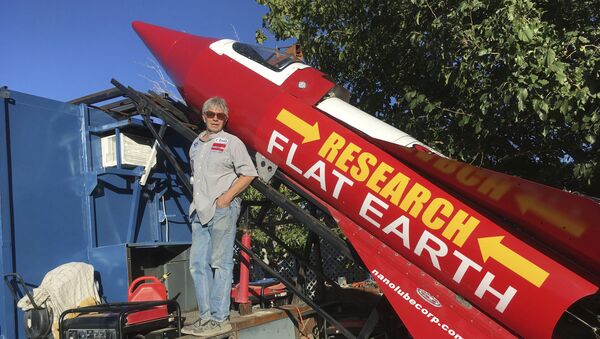 In this Wednesday, Nov. 15, 2017, photograph, daredevil/limousine driver Mad Mike Hughes is shown with with his steam=powered rocket constructed out of salvage parts on a five-acre property that he leases in Apple Valley, Cal. - Sputnik International
