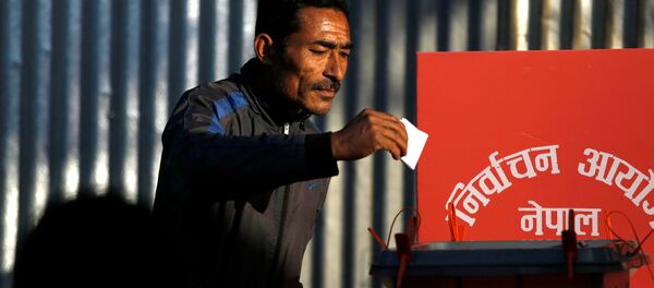 A man cast his vote on a ballot box during the parliamentary and provincial elections at Chautara in Sindhupalchok District November 26, 2017 A man cast his vote on a ballot box during the parliamentary and provincial elections at Chautara in Sindhupalchok District November 26, 2017 - Sputnik International