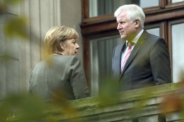 Chancellor Angela Merkel, left, talks to Bavarian governor Horst Seehofer during talks on forming a new government in Berlin Thursday, Oct. 26 2017 Chancellor Angela Merkel, left, talks to Bavarian governor Horst Seehofer during talks on forming a new government in Berlin Thursday, Oct. 26 2017 - Sputnik International