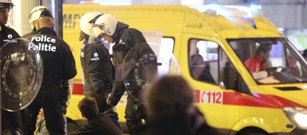 Police stand over a group of youths during unrest in Brussels on Wednesday, Nov. 15, 2017 - Sputnik International