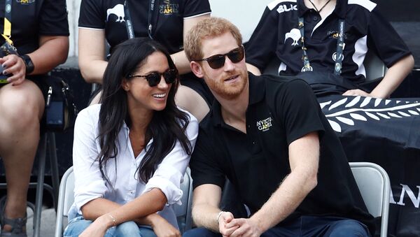 Britain's Prince Harry (R) sits with girlfriend actress Meghan Markle to watch a wheelchair tennis event during the Invictus Games in Toronto, Ontario, Canada September 25, 2017 - Sputnik International