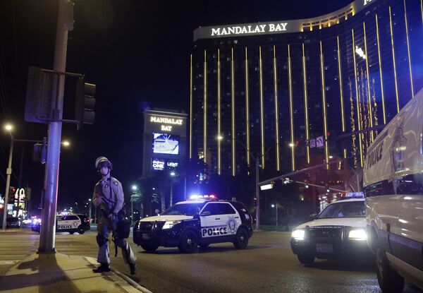Police officers stand along the Las Vegas Strip near the Mandalay Bay resort and casino during a shooting at a country music festival, in Las Vegas. (File) - Sputnik International