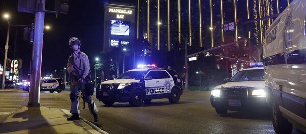 Police officers stand along the Las Vegas Strip near the Mandalay Bay resort and casino during a shooting at a country music festival, in Las Vegas. (File) Police officers stand along the Las Vegas Strip near the Mandalay Bay resort and casino during a shooting at a country music festival, in Las Vegas. (File) - Sputnik International