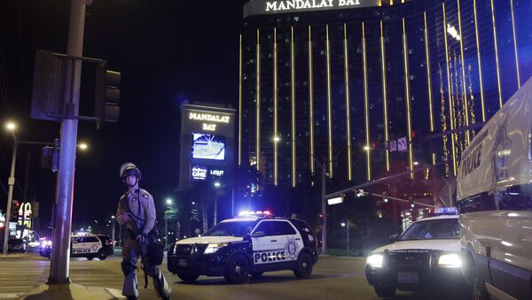 Police officers stand along the Las Vegas Strip near the Mandalay Bay resort and casino during a shooting at a country music festival, in Las Vegas. (File) - Sputnik International