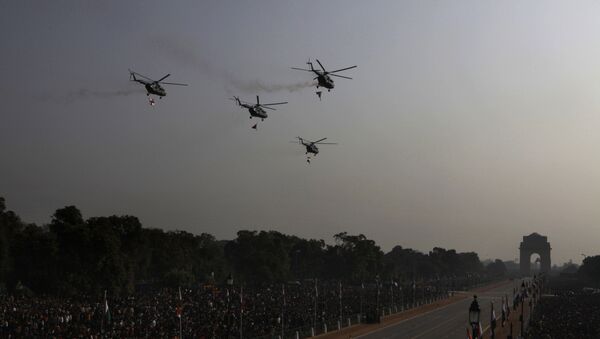 Mi-17 helicopters shower flower petals before the start of the Republic Day parade in New Delhi, India, Wednesday, Jan. 26, 2011 - Sputnik International