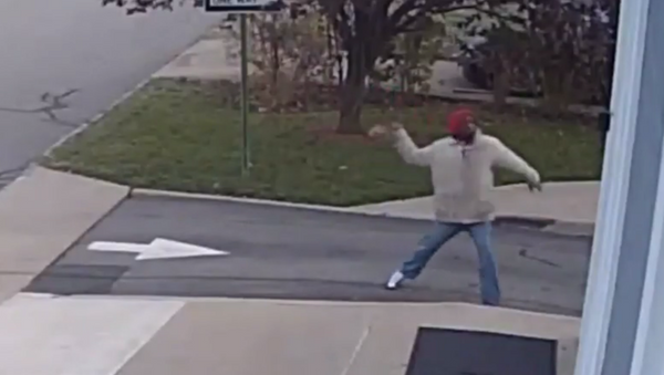 Zuri Towns is seen throwing rocks at the Morristown Church of Christ and Church of God in Christ for All Saints in the church's security footage - Sputnik International
