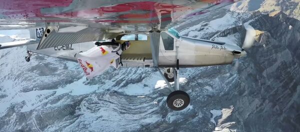 2 wingsuit flyers BASE jump into a plane in mid-air. | A Door In The Sky 2 wingsuit flyers BASE jump into a plane in mid-air. | A Door In The Sky - Sputnik International