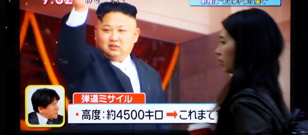 A woman walks past a street monitor showing North Korea's leader Kim Jong Un in a news report about North Korea's missile launch, in Tokyo, Japan, November 29, 2017 A woman walks past a street monitor showing North Korea's leader Kim Jong Un in a news report about North Korea's missile launch, in Tokyo, Japan, November 29, 2017 - Sputnik International