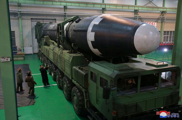 North Korea's leader Kim Jong-un is seen as the newly developed intercontinental ballistic rocket Hwasong-15's test was successfully launched, in this undated photo released by North Korea's Korean Central News Agency (KCNA) in Pyongyang November 30, 2017 North Korea's leader Kim Jong-un is seen as the newly developed intercontinental ballistic rocket Hwasong-15's test was successfully launched, in this undated photo released by North Korea's Korean Central News Agency (KCNA) in Pyongyang November 30, 2017 - Sputnik International