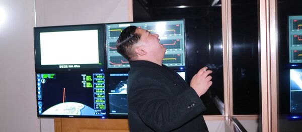North Korea's leader Kim Jong-un is seen as the newly developed intercontinental ballistic rocket Hwasong-15's test was successfully launched, in this undated photo released by North Korea's Korean Central News Agency (KCNA) in Pyongyang November 30, 2017 - Sputnik International