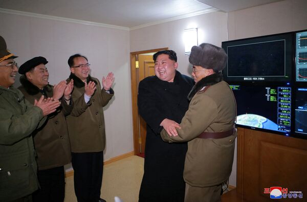 North Korea's leader Kim Jong-un is seen as the newly developed intercontinental ballistic rocket Hwasong-15's test was successfully launched, in this undated photo released by North Korea's Korean Central News Agency (KCNA) in Pyongyang November 30, 2017 North Korea's leader Kim Jong-un is seen as the newly developed intercontinental ballistic rocket Hwasong-15's test was successfully launched, in this undated photo released by North Korea's Korean Central News Agency (KCNA) in Pyongyang November 30, 2017 - Sputnik International
