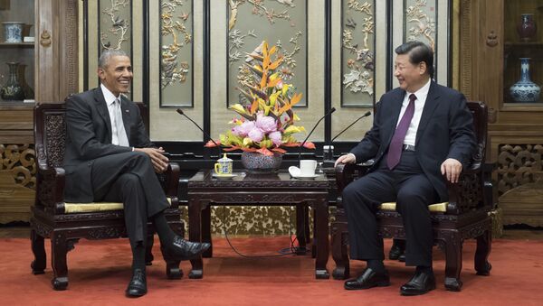 In this Wednesday, Nov. 29, 2017, photo released by China's Xinhua News Agency, former U.S. President Barack Obama, left, meets with Chinese President Xi Jinping at the Diaoyutai State Guesthouse in Beijing - Sputnik International