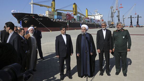 Iranian President Hassan Rouhani, center, speaks during the inauguration a newly built extension of the port of Chabahar, near the Pakistani border, on the Gulf of Oman, southeastern Iran, Sunday, Dec. 3, 2017 - Sputnik International