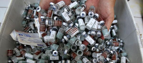 A worker shows used anti-dengue vaccine Dengvaxia inside a vaccine storage room in Sta. Cruz city, Metro Manila, Philippines December 4, 2017 A worker shows used anti-dengue vaccine Dengvaxia inside a vaccine storage room in Sta. Cruz city, Metro Manila, Philippines December 4, 2017 - Sputnik International