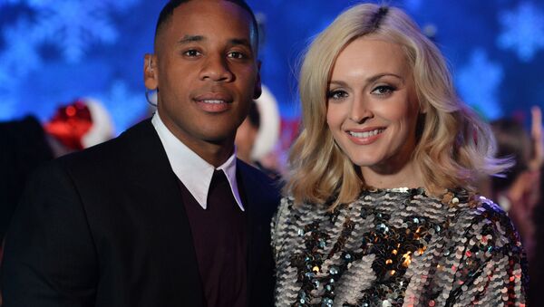 Reggie Yates and Fearne Cotton present BBC 1's Christmas Day Special Top of the Pops in London on Saturday, Dec. 7, 2013. - Sputnik International