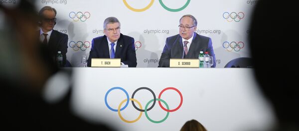 Samuel Schmid, Chair of the IOC Disciplinary Commission, and Thomas Bach, President of the International Olympic Committee, attend a news conference after an Executive Board meeting on sanctions for Russian athletes, in Lausanne, Switzerland, December 5, 2017 Samuel Schmid, Chair of the IOC Disciplinary Commission, and Thomas Bach, President of the International Olympic Committee, attend a news conference after an Executive Board meeting on sanctions for Russian athletes, in Lausanne, Switzerland, December 5, 2017 - Sputnik International