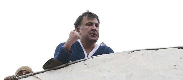 Georgian former President Mikheil Saakashvili is seen on the roof of a building during a search of his apartment in Kiev, Ukraine Georgian former President Mikheil Saakashvili is seen on the roof of a building during a search of his apartment in Kiev, Ukraine - Sputnik International