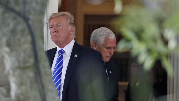 President Donald Trump steps out of the Oval Office, with Vice President Mike Pence behind him, as Trump walks to board Marine One at the White House, Tuesday, Sept. 26, 2017, in Washington - Sputnik International