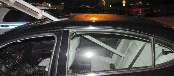 A photo provided by the South Hackensack Police Department shows a car with a mass transit sign sticking out of the roof. - Sputnik International