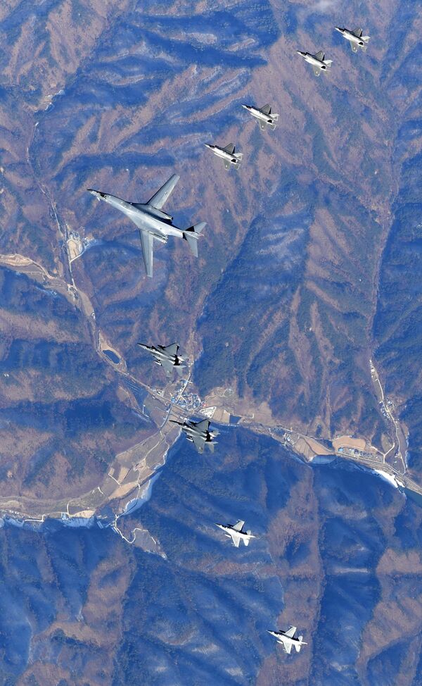 In this photo provided by South Korea Defense Ministry, U.S. Air Force B-1B bomber, center, flies over the Korean Peninsula with South Korean fighter jets F-16, F-15K and U.S. fighter jets F-35A, F35B during their combined aerial exercise Wednesday, Dec. 6, 2017 In this photo provided by South Korea Defense Ministry, U.S. Air Force B-1B bomber, center, flies over the Korean Peninsula with South Korean fighter jets F-16, F-15K and U.S. fighter jets F-35A, F35B during their combined aerial exercise Wednesday, Dec. 6, 2017 - Sputnik International
