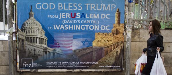 A woman walks past a poster praising U.S. President Donald Trump’s recognition of Jerusalem as Israel’s capital, in Jerusalem, Thursday, Dec. 7, 2017 A woman walks past a poster praising U.S. President Donald Trump’s recognition of Jerusalem as Israel’s capital, in Jerusalem, Thursday, Dec. 7, 2017 - Sputnik International