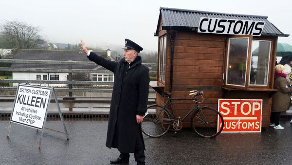 Demonstrators dressed as custom officials set up a mock customs checkpoint at the border crossing in Killeen, near Dundalk to protest against the potential introduction of border checks following the decision by the UK to leave the EU on February 18, 2017 - Sputnik International