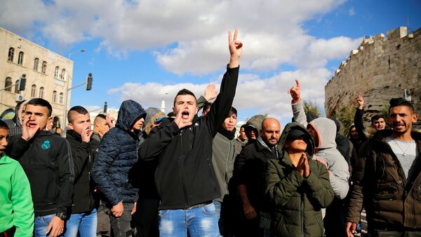 Palestinians shout slogans during a protest following U.S. President Donald Trump's announcement that he has recognized Jerusalem as Israel's capital, near Damascus Gate in Jerusalem's Old City December 7, 2017 - Sputnik International