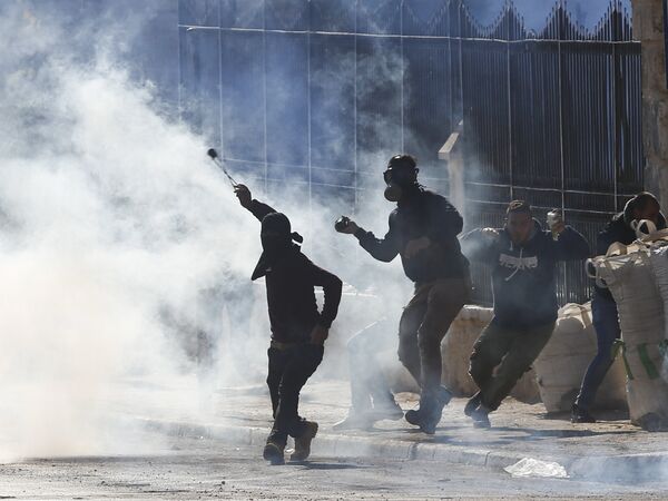 Palestinians clash with Israeli troops during a protest against U.S. President Donald Trump's decision to recognize Jerusalem as the capital of Israel in the West Bank city of Bethlehem, Friday, Dec.8, 2017 Palestinians clash with Israeli troops during a protest against U.S. President Donald Trump's decision to recognize Jerusalem as the capital of Israel in the West Bank city of Bethlehem, Friday, Dec.8, 2017 - Sputnik International