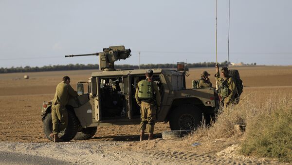 Israeli soldiers stand near the border with Gaza. (File) - Sputnik International
