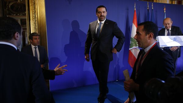 Lebanon's Prime Minister Saad Hariri walks off stage after a press conference held in Paris as part of a summit convened by France to bolster Lebanon's institutions, Friday Dec. 8, 2017. It is the first major gathering of key nations to discuss Lebanon's future since a crisis erupted following Hariri's shock resignation last month while in Saudi Arabia. Hariri has since rescinded his resignation.  - Sputnik International