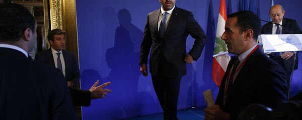 Lebanon's Prime Minister Saad Hariri walks off stage after a press conference held in Paris as part of a summit convened by France to bolster Lebanon's institutions, Friday Dec. 8, 2017. It is the first major gathering of key nations to discuss Lebanon's future since a crisis erupted following Hariri's shock resignation last month while in Saudi Arabia. Hariri has since rescinded his resignation. - Sputnik International