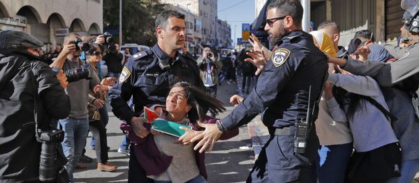 Israeli police disperse Palestinian protesters on December 9, 2017, in East Jerusalem. Retaliatory Israeli air strikes on the Gaza Strip killed two Hamas militants, as unrest simmered across the Palestinian territories over US President Donald Trump's declaration of Jerusalem as Israel's capital Israeli police disperse Palestinian protesters on December 9, 2017, in East Jerusalem. Retaliatory Israeli air strikes on the Gaza Strip killed two Hamas militants, as unrest simmered across the Palestinian territories over US President Donald Trump's declaration of Jerusalem as Israel's capital - Sputnik International