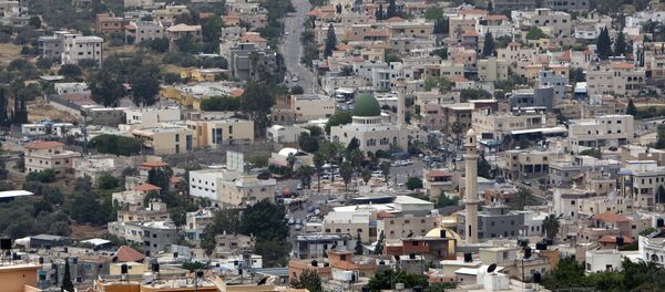 A general view shows the Arab village of Bartaa in Wadi Ara which straddles the Green Line between Israel and the Palestinian territories A general view shows the Arab village of Bartaa in Wadi Ara which straddles the Green Line between Israel and the Palestinian territories - Sputnik International