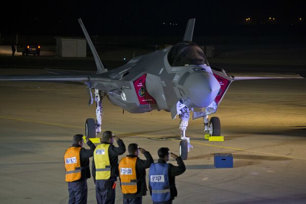 Israeli air force officers salute toward one of the first two next-generation F-35 fighter jets during an unveiling ceremony after it landed in Nevatim Air Force base near Beersheba, Southern Israel, Monday, Dec. 12, 2016 Israeli air force officers salute toward one of the first two next-generation F-35 fighter jets during an unveiling ceremony after it landed in Nevatim Air Force base near Beersheba, Southern Israel, Monday, Dec. 12, 2016 - Sputnik International