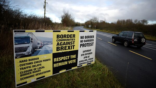 A sign from Border Communities Against Brexit is seen on the borderline between County Cavan in Ireland and County Fermanagh in Northern Ireland near Woodford, Ireland, November 30, 2017 - Sputnik International
