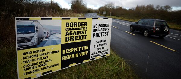A sign from Border Communities Against Brexit is seen on the borderline between County Cavan in Ireland and County Fermanagh in Northern Ireland near Woodford, Ireland, November 30, 2017 A sign from Border Communities Against Brexit is seen on the borderline between County Cavan in Ireland and County Fermanagh in Northern Ireland near Woodford, Ireland, November 30, 2017 - Sputnik International