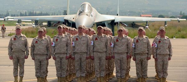 Servicemen are seen here at the Russian air base in Khmeimim during a military parade marking the 72nd anniversary of Victory in the 1941-45 Great Patriotic War. File photo - Sputnik International