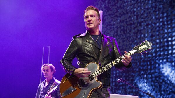 Josh Homme of Queens of the Stone Age performs at the 2017 KROQ Almost Acoustic Christmas at The Forum on Saturday, Dec. 9, 2017, in Inglewood, Calif. - Sputnik International