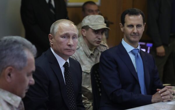 President of Russia Vladimir Putin and President of Syria Bashar al-Assad (right) at the Khmeimim Air Base in Syria President of Russia Vladimir Putin and President of Syria Bashar al-Assad (right) at the Khmeimim Air Base in Syria - Sputnik International