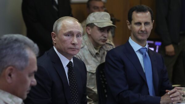 President of Russia Vladimir Putin and President of Syria Bashar al-Assad (right) at the Khmeimim Air Base in Syria - Sputnik International