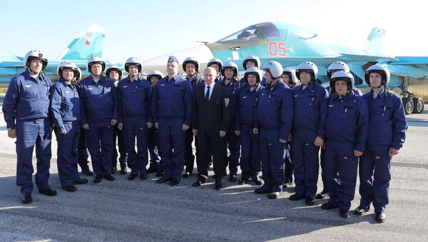 Russian President Vladimir Putin visits the Hmeymim Airbase in Syria on December 11, 2017 - Sputnik International