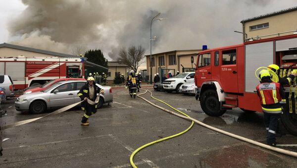 Emergency crews are seen attending to a fire after reports of a gas explosion in Baumgarten, Austria December 12, 2017 in this picture obtained from social media - Sputnik International