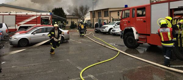 Emergency crews are seen attending to a fire after reports of a gas explosion in Baumgarten, Austria December 12, 2017 in this picture obtained from social media - Sputnik International