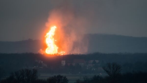 A column of fire is seen after an explosion ripped through Austria's main gas pipeline hub in Baumgarten, Austria December 12, 2017 in this picture obtained from social media - Sputnik International