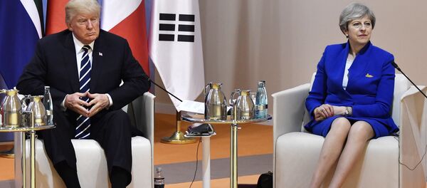 US President Donald Trump and Britain's Prime Minister Theresa May sit at the start of the retreat meeting on the first day of the G-20 summit in Hamburg, northern Germany, on Friday July 7, 2017. - Sputnik International
