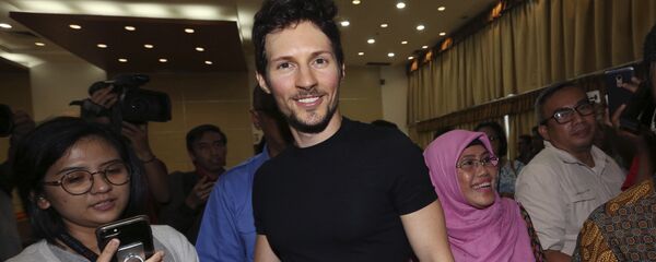 Telegram co-founder Pavel Durov, center, smiles as he leaves after a press conference following his meeting with Indonesian Communication and Information Minister Rudiantara in Jakarta, Indonesia Tuesday, Aug. 1, 2017 Telegram co-founder Pavel Durov, center, smiles as he leaves after a press conference following his meeting with Indonesian Communication and Information Minister Rudiantara in Jakarta, Indonesia Tuesday, Aug. 1, 2017 - Sputnik International